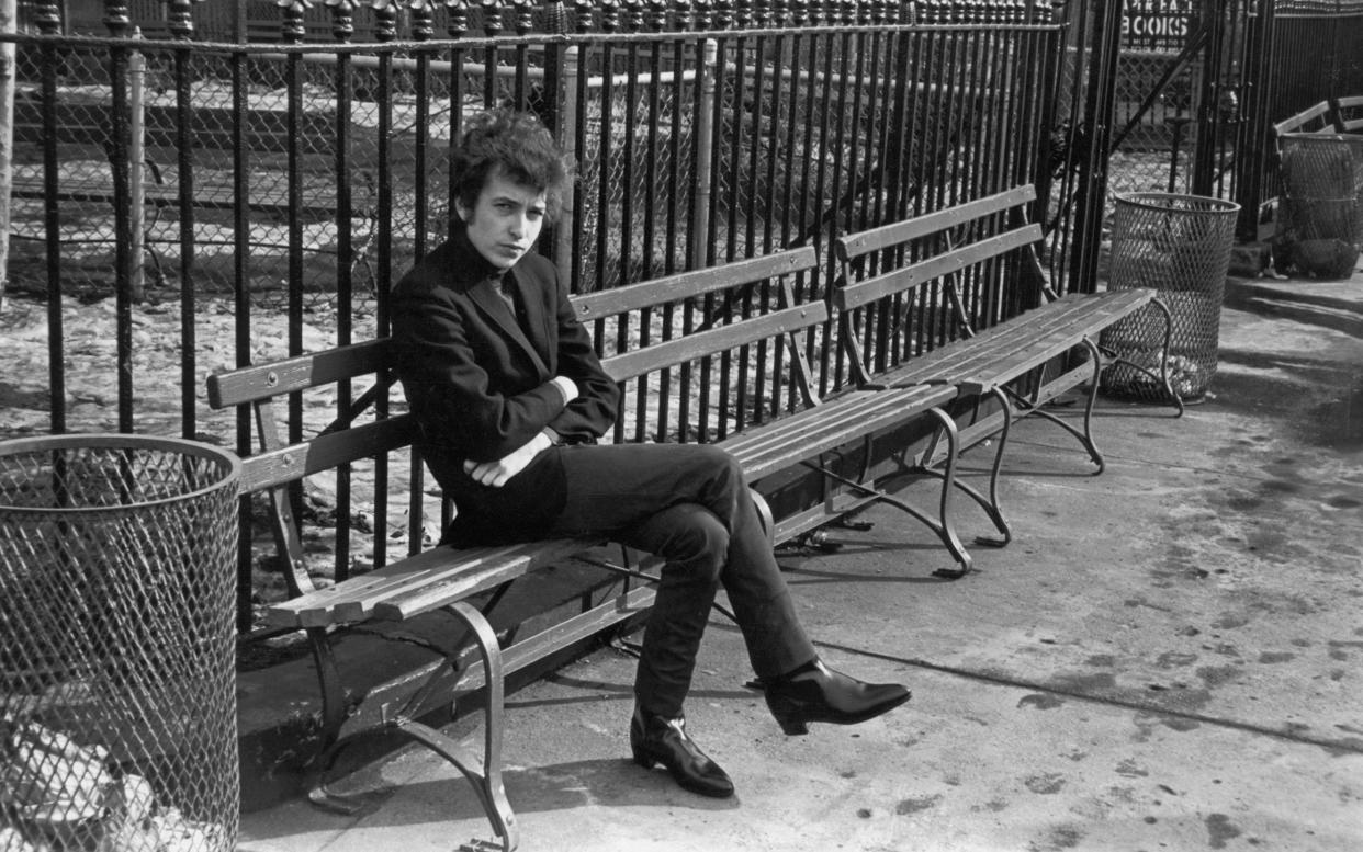 Bob Dylan in New York's Sheridan Square Park in 1965, the year Bringing It All Back Home was released - Getty