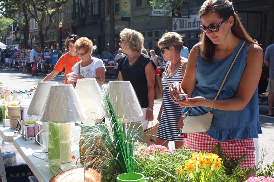 Shopping in downtown Holland during the annual Sidewalk Sales on Eighth Street.