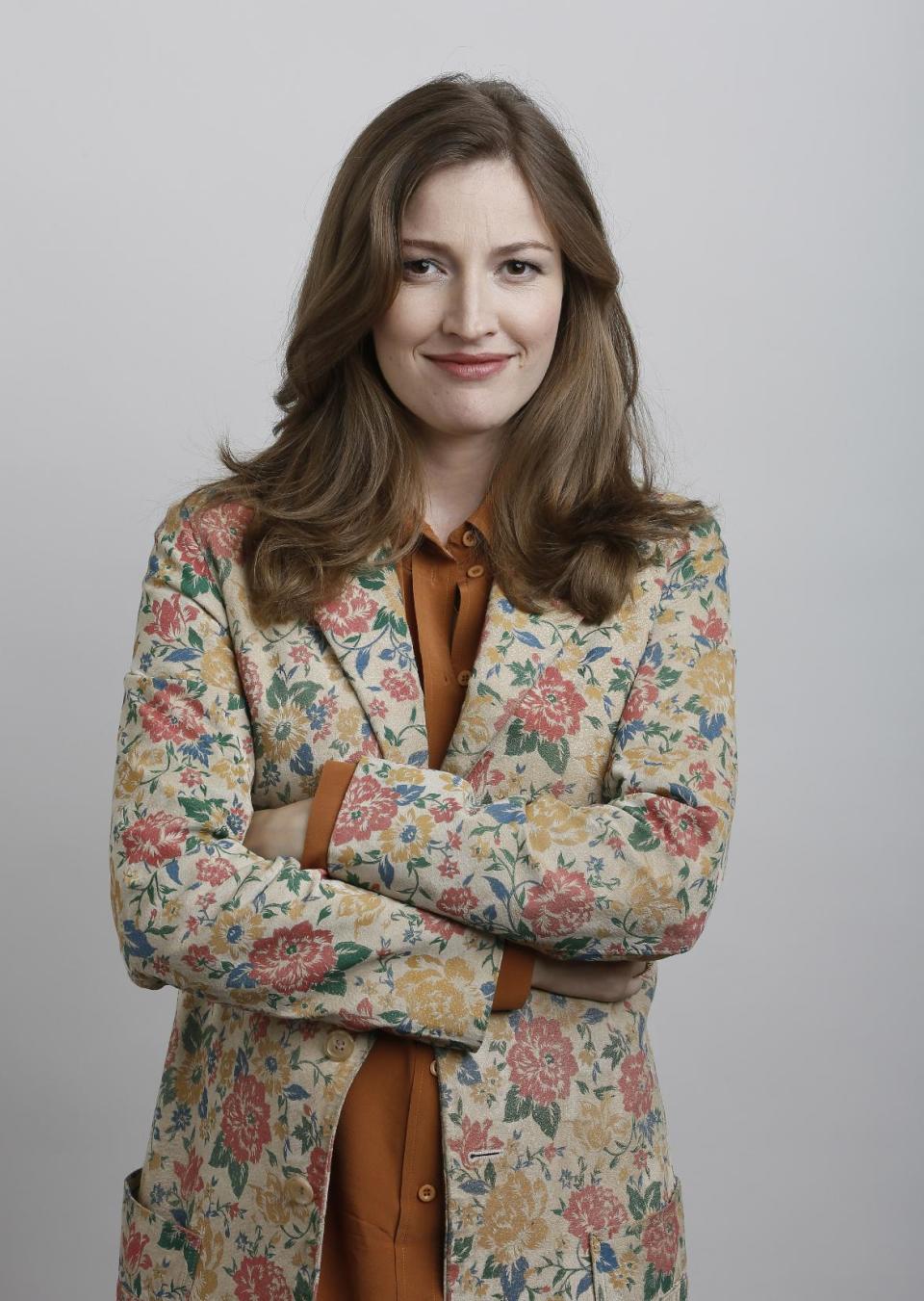 In this June 18, 2012 photo, actress Kelly Macdonald poses for a portrait during the "Brave" press day at Loews Hollywood Hotel, in Los Angeles. The top spot at the box office is rare turf for Kelly Macdonald, a character actress known on the big-screen mainly for supporting roles in such films as "No Country for Old Men" and "Finding Neverland." With her wild red mane and her killer skills with sword and bow, Macdonald has become the latest in Hollywood's growing line of successful female action heroes. (Photo by Todd Williamson/Invision/AP)