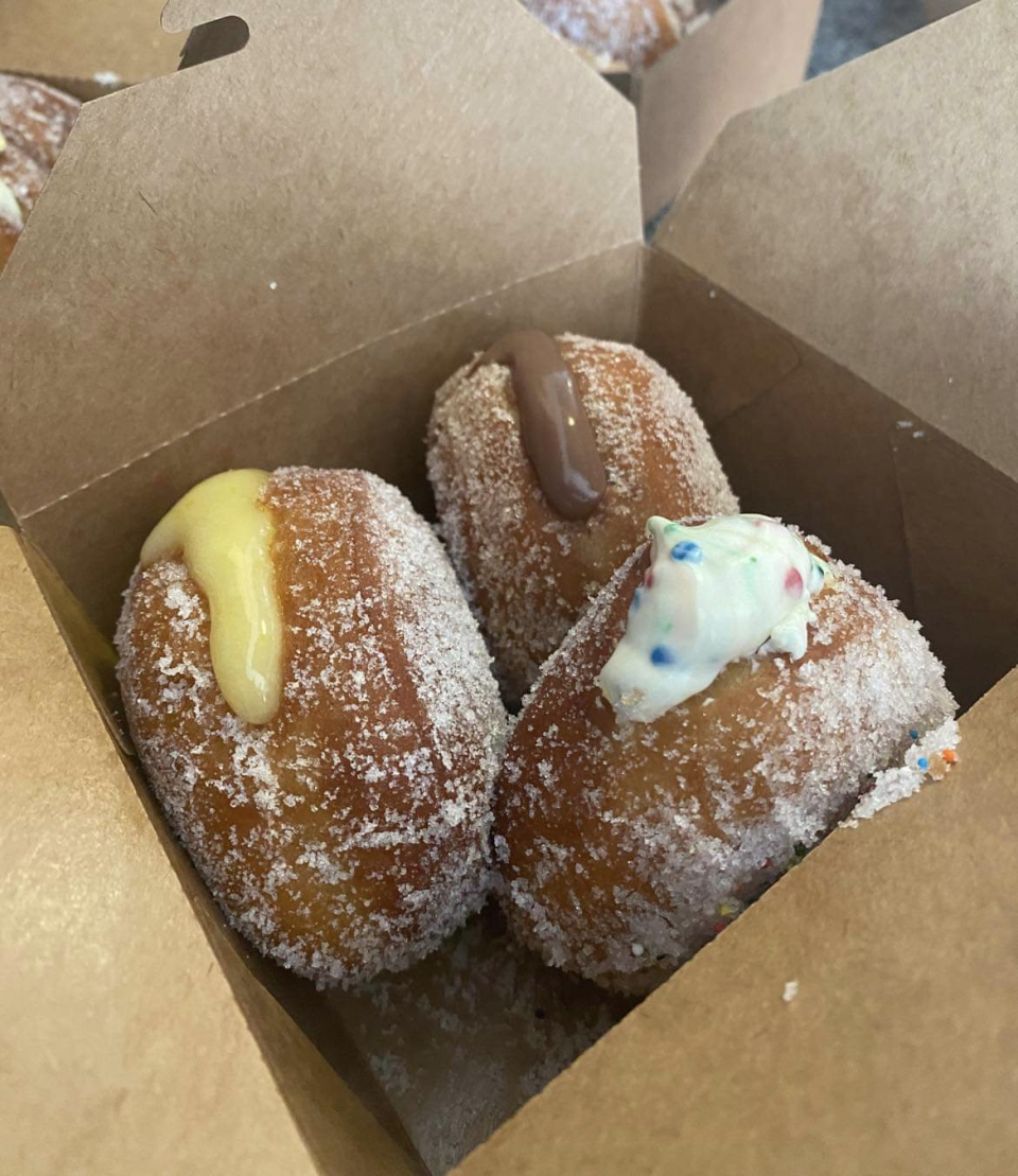 Stuffed fried bourbon buttermilk brown butter brioche doughnuts from the Books, Bourbon & Bacon food truck.