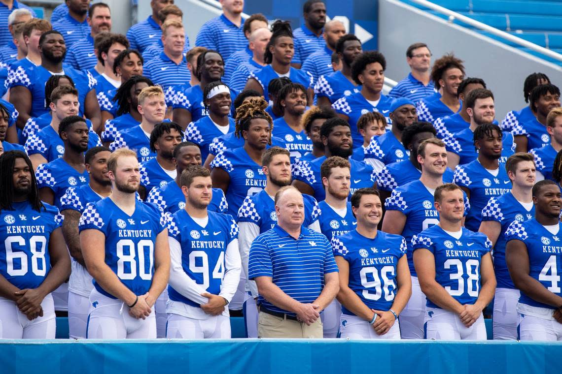 Kentucky head coach Mark Stoops and the Wildcats pose for the annual team picture during Media Day on Wednesday at Kroger Field.