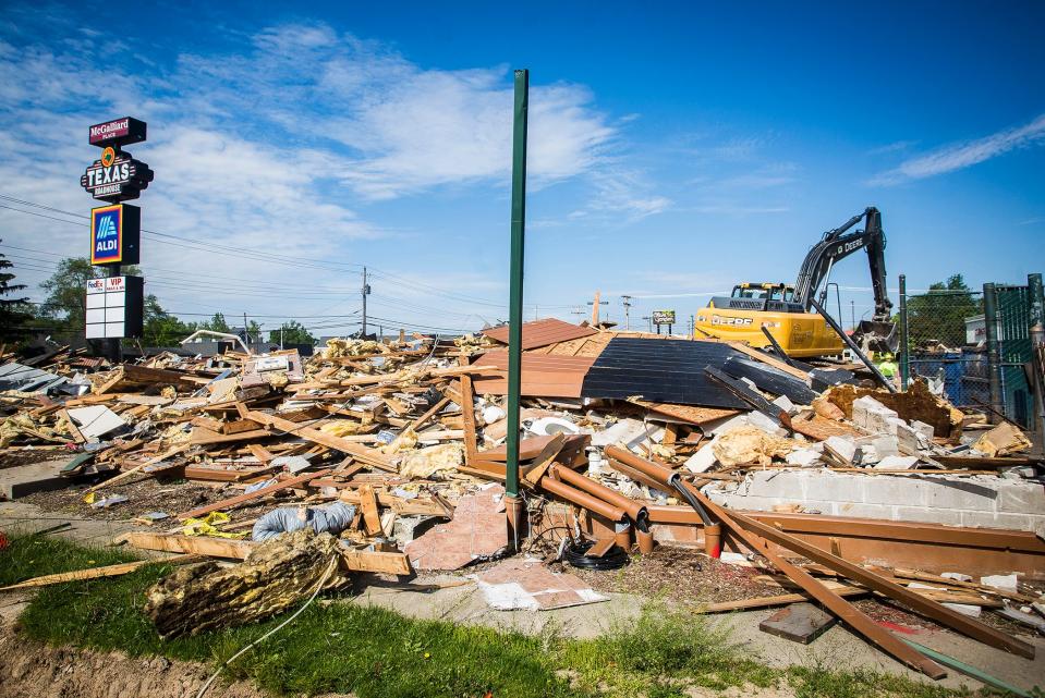 Demolition of the former Texas Roadhouse building was under way Tuesday, May 26, 2020, after the opening of the new restaurant next door along McGalliard Road.
