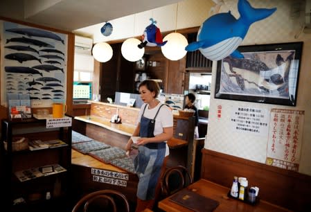 Yoko Ichihara takes order from customers at her restaurant named P-man in Minamiboso