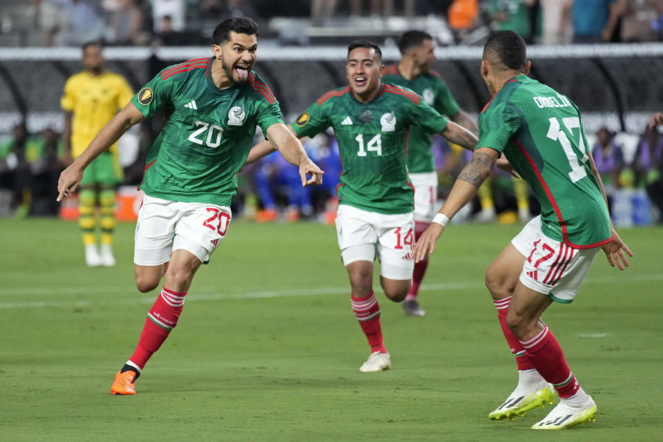 Mexico's Henry Martin, left, celebrates after scoring against Jamaica during the first half of a CONCACAF Gold Cup semifinals soccer match Wednesday, July 12, 2023, in Las Vegas. (AP Photo/John Locher)