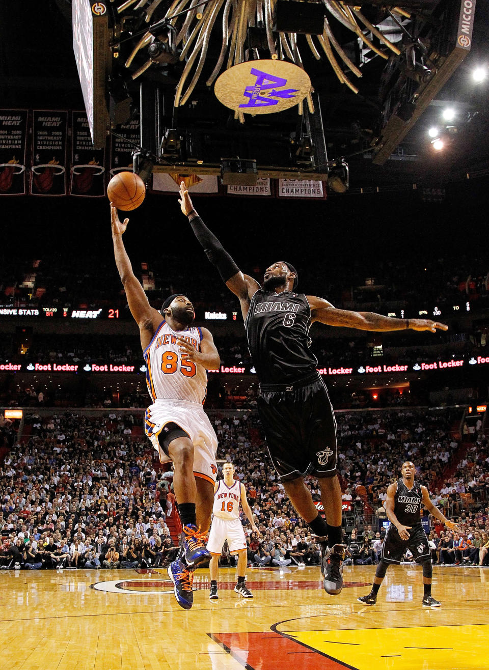 MIAMI, FL - FEBRUARY 23: Baron Davis #85 of the New York Knicks shoots over LeBron James #6 of the Miami Heat during a game at American Airlines Arena on February 23, 2012 in Miami, Florida. NOTE TO USER: User expressly acknowledges and agrees that, by downloading and/or using this Photograph, User is consenting to the terms and conditions of the Getty Images License Agreement. (Photo by Mike Ehrmann/Getty Images)