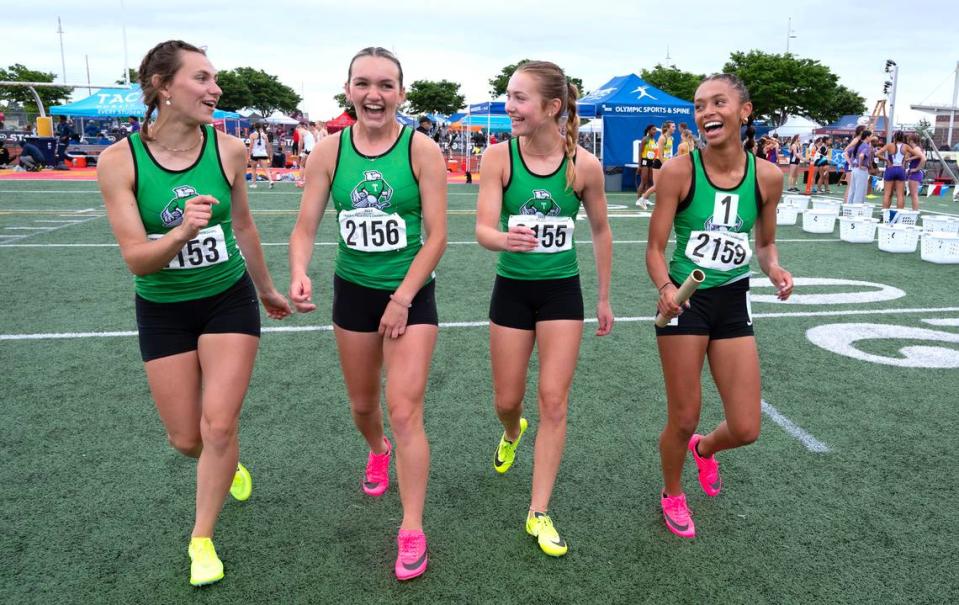 Tumwater’s Annabelle Clapp, Reese Heryford, Cassidy Henin and Ava Jones celebrate following their state title in the 2A girls 4x200 relay during the final day of the WIAA state track and field championships at Mount Tahoma High School in Tacoma, Washington, on Friday, May 26, 2023.