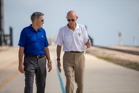 Astronaut Michael Collins speaks with NASA's John F. Kennedy Space Center Director Bob Cabana at Launch Pad 39A at the NASA's John F. Kennedy Space Center on the 50th anniversary of the launch of the Apollo 11 mission to the moon, in Cape Canaveral