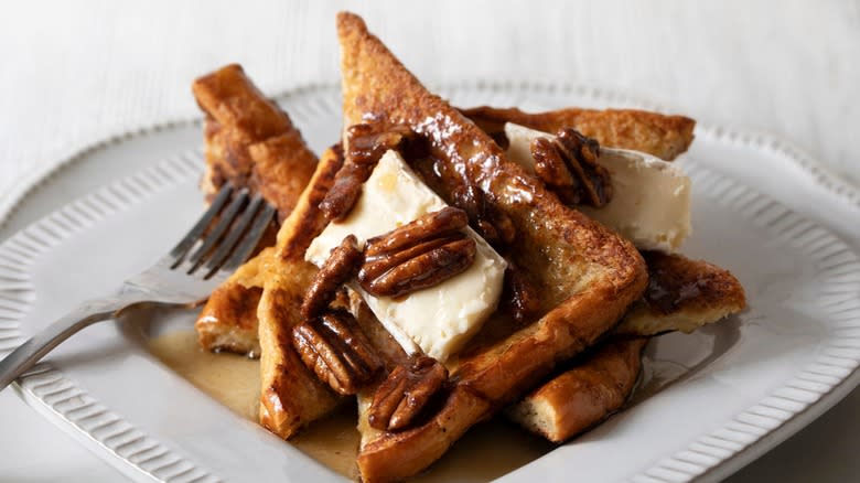 Syrup on French toast with walnuts