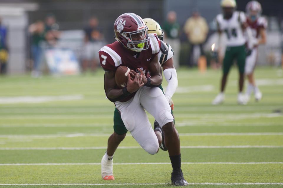 First Baptist defeated Trinity Catholic, 21-3, in the Suburban 1 football state championship game on Dec. 10, 2022, at Gene Cox Stadium. FBA's Rich Mellien finds room to run.