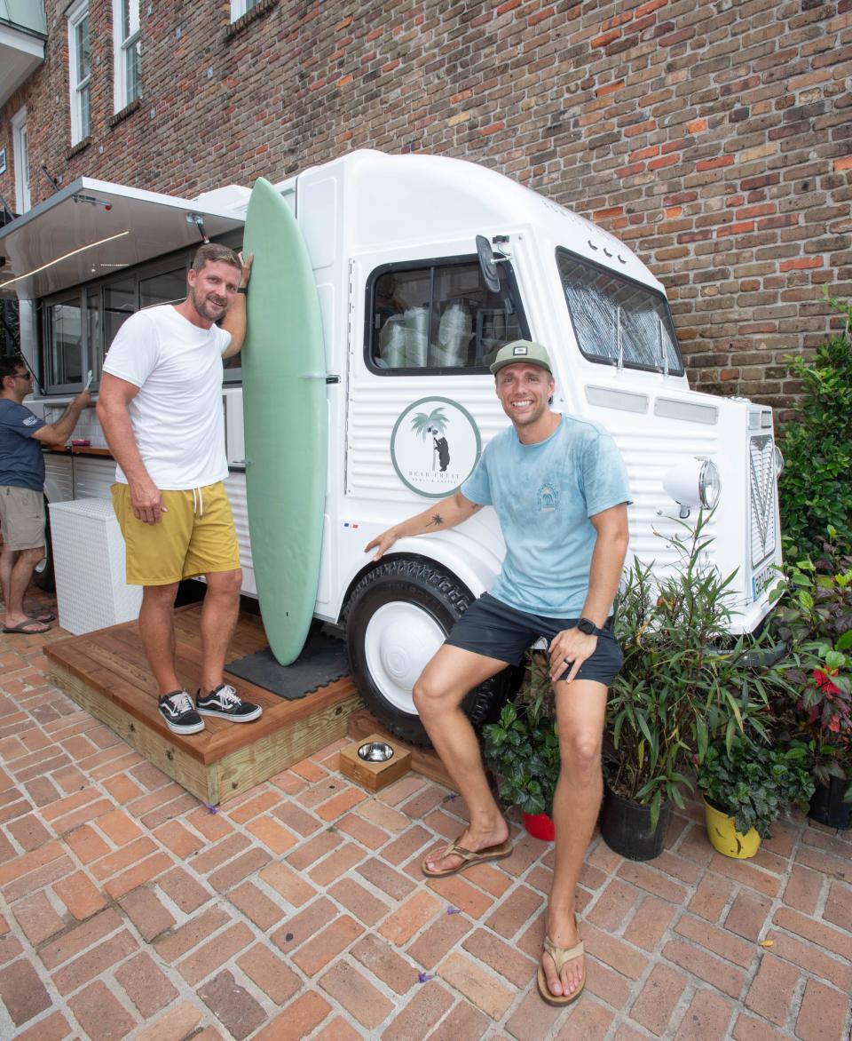 Bear Fruit Bowls and Coffee owner Ryan Ford, right, and local partner Sam Cambron pose outside the food truck on South Tarragona Street in downtown Pensacola on Wednesday, June 28, 2023.