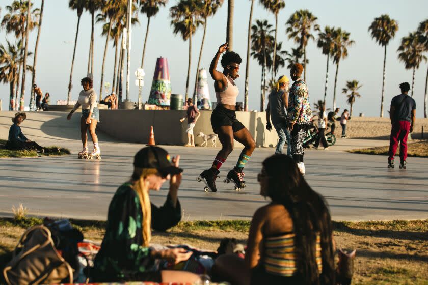 VENICE, CA - JUNE 29: Bianca Povalitis along with fellow roller skaters enjoy an evening at Venice Beach Skate Plaza one of the few remaining places in the Los Angeles Area to roller skate on Wednesday, June 29, 2022 in Venice, CA. (Jason Armond / Los Angeles Times)