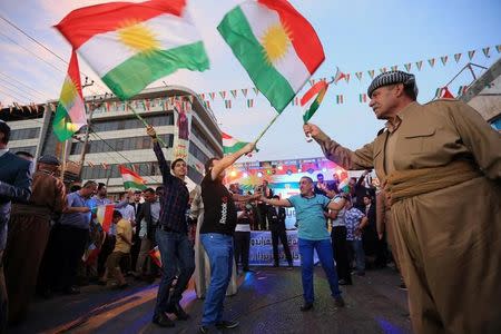 Kurds celebrate to show their support for the independence referendum in Duhok, Iraq, September 26, 2017. REUTERS/Ari Jalal