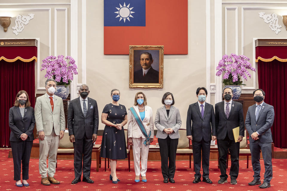 In this photo released by the Taiwan Presidential Office, U.S. House Speaker Nancy Pelosi and Taiwanese President President Tsai Ing-wen, center, pose for a photo during a meeting in Taipei, Taiwan, Wednesday, Aug. 3, 2022. U.S. House Speaker Nancy Pelosi, meeting top officials in Taiwan despite warnings from China, said Wednesday that she and other congressional leaders in a visiting delegation are showing they will not abandon their commitment to the self-governing island. (Taiwan Presidential Office via AP)