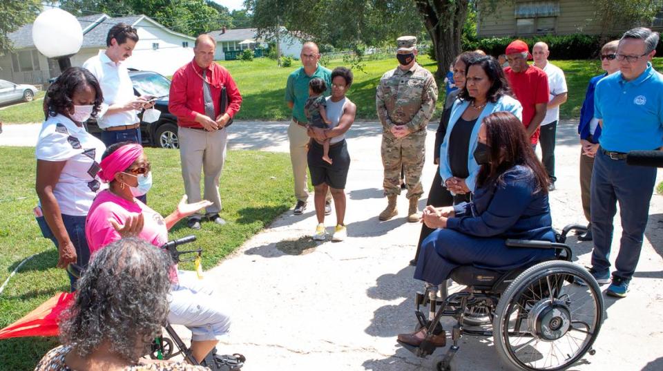 U.S. Senator Tammy Duckworth (D-IL) speaks with Cahokia Heights residents, including, Yvette Lyles, during a visit to a neighborhood that has persistent sewer and flooding issues. Sen. Duckworth was joined by state and federal representatives that will help oversee the funding and implementation of the future projects to help eliminate the sewer issues in the neighborhood. Derik Holtmann/dholtmann@bnd.com