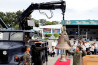 Philippine Air Force personnel unload the bells of Balangiga after their arrival at Villamor Air Base in Pasay, Metro Manila in Philippines December 11, 2018. REUTERS/Erik De Castro