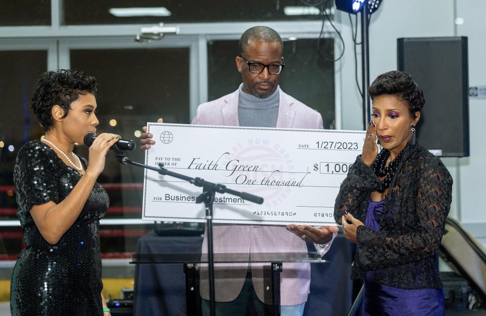 Faith Green was presented with a $1,000 check at the How Understanding Something Helps (H.U.S.H.)'s "Painting My Pain" event on Jan. 27 at the Riverside Marina to help fund the businesses she created in honor of her four children who were killed due to domestic abuse.