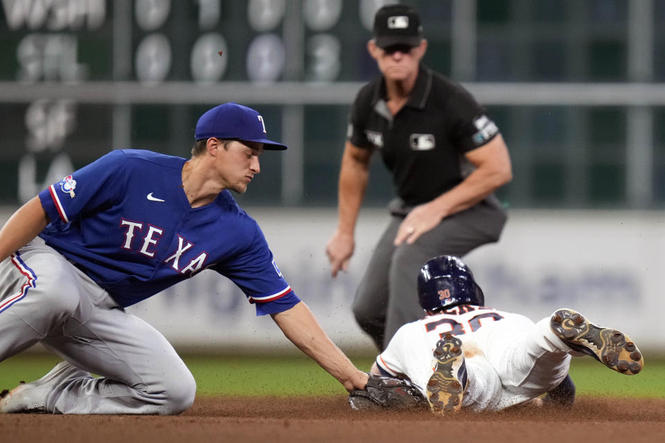 Houston Astros' Kyle Tucker, right, steals second as Texas Rangers shortstop Corey Seager applies the tag during the fourth inning of a baseball game Tuesday, Sept. 6, 2022, in Houston. (AP Photo/Eric Christian Smith)