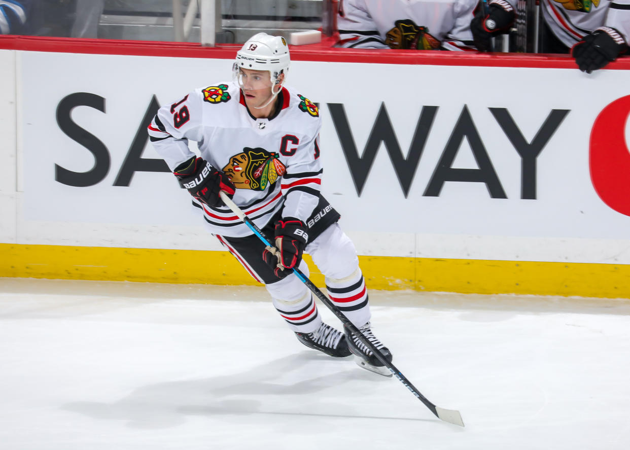 WINNIPEG, MB - FEBRUARY 16: Jonathan Toews #19 of the Chicago Blackhawks keeps an eye on the play during third period action against the Winnipeg Jets at the Bell MTS Place on February 16, 2020 in Winnipeg, Manitoba, Canada. The Jets defeated the Hawks 3-2. (Photo by Jonathan Kozub/NHLI via Getty Images)