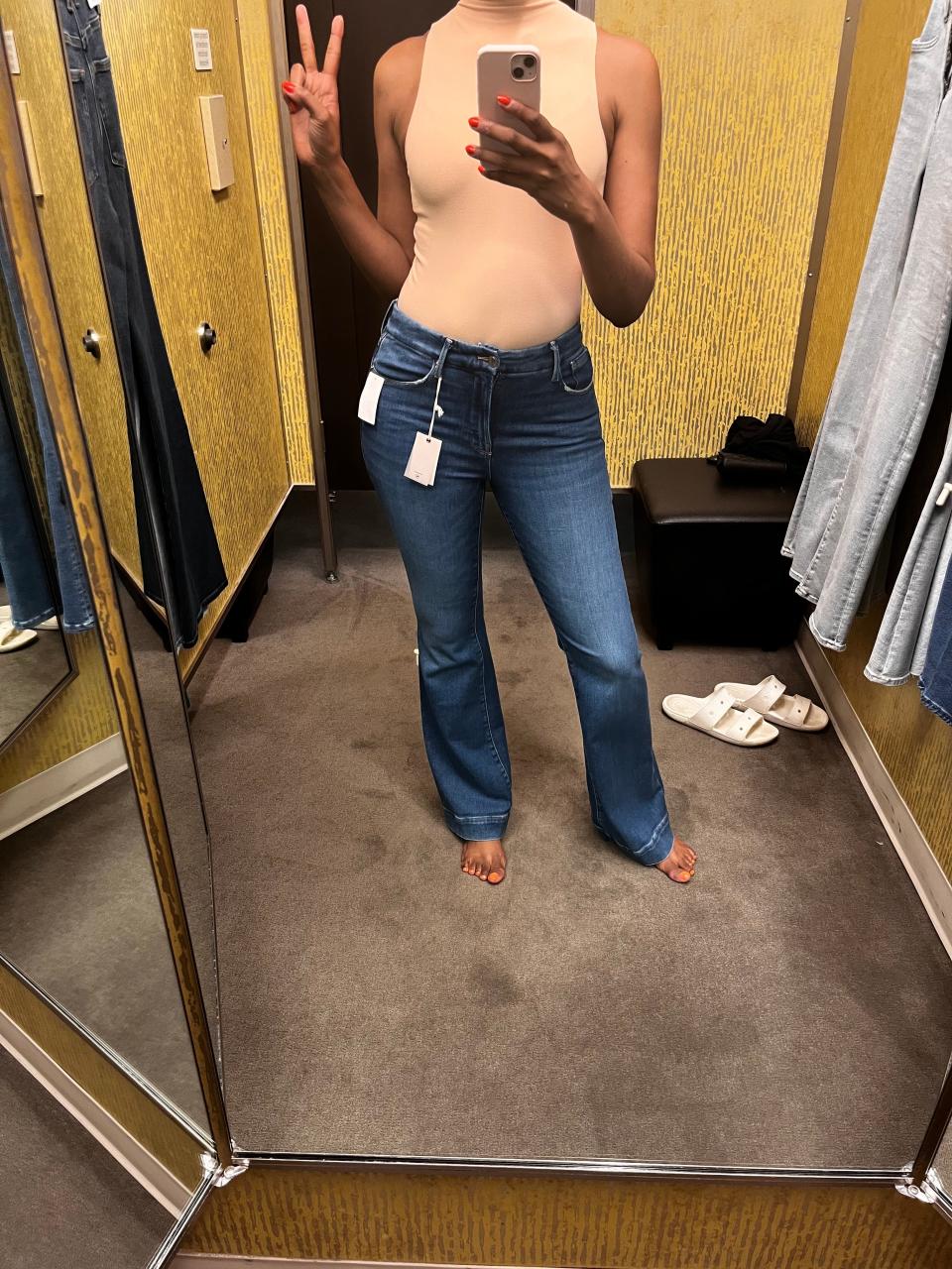 Author Joi-Marie McKenzie trying on jeans in a Nordstrom dressing room.