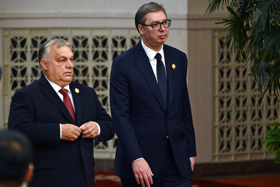 Hungarian Prime Minister Viktor Orban, left, and Serbian President Aleksandar Vucic head to a group photo session at the Belt and Road Forum in Beijing Wednesday, on Wednesday, Oct. 18, 2023. (Grigory Sysoyev, Sputnik, Kremlin Pool Photo via AP)