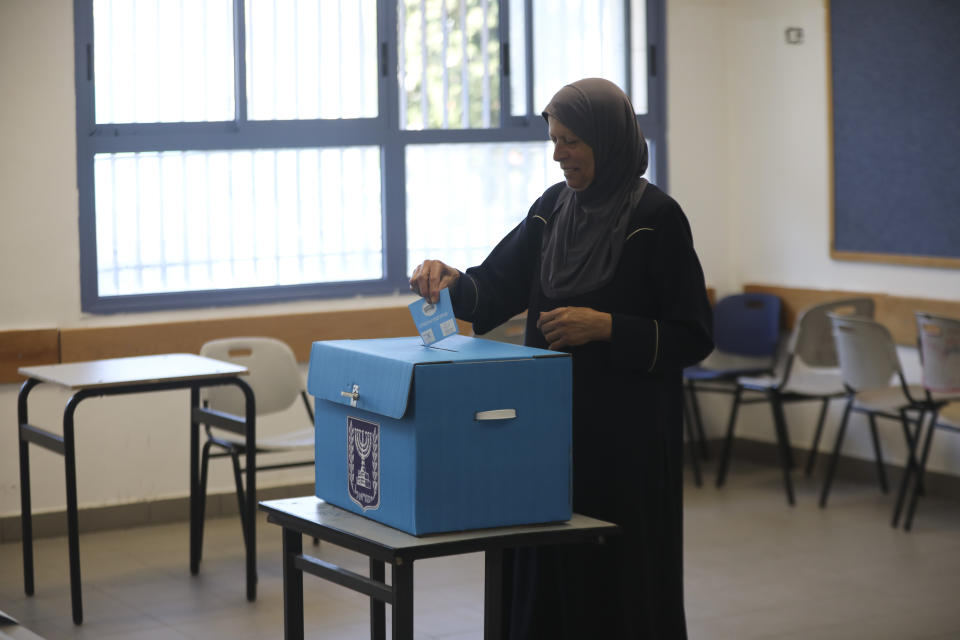 A woman votes in Jerusalem Tuesday, Sept. 17, 2019. Israelis began voting Tuesday in an unprecedented repeat election that will decide whether longtime Prime Minister Benjamin Netanyahu stays in power despite a looming indictment on corruption charges. (AP Photo/Mahmoud Illean)