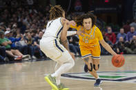 Kent State's Jalen Sullinger (13) drives as Akron's Shammah Scot, left, defends during the second half of an NCAA college basketball game in the championship of the Mid-American Conference tournament, Saturday, March 16, 2024, in Cleveland. (AP Photo/Phil Long)