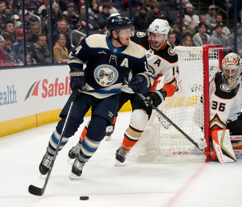 Jan. 19, 2023; Columbus, Ohio, USA; Columbus Blue Jackets left wing Gustav Nyquist (14) is pursued by Anaheim Ducks center Adam Henrique (14) during the third period of Thursday's game at Nationwide Arena. The Ducks won the game 5-3. Mandatory Credit: Barbara J. Perenic/Columbus Dispatch