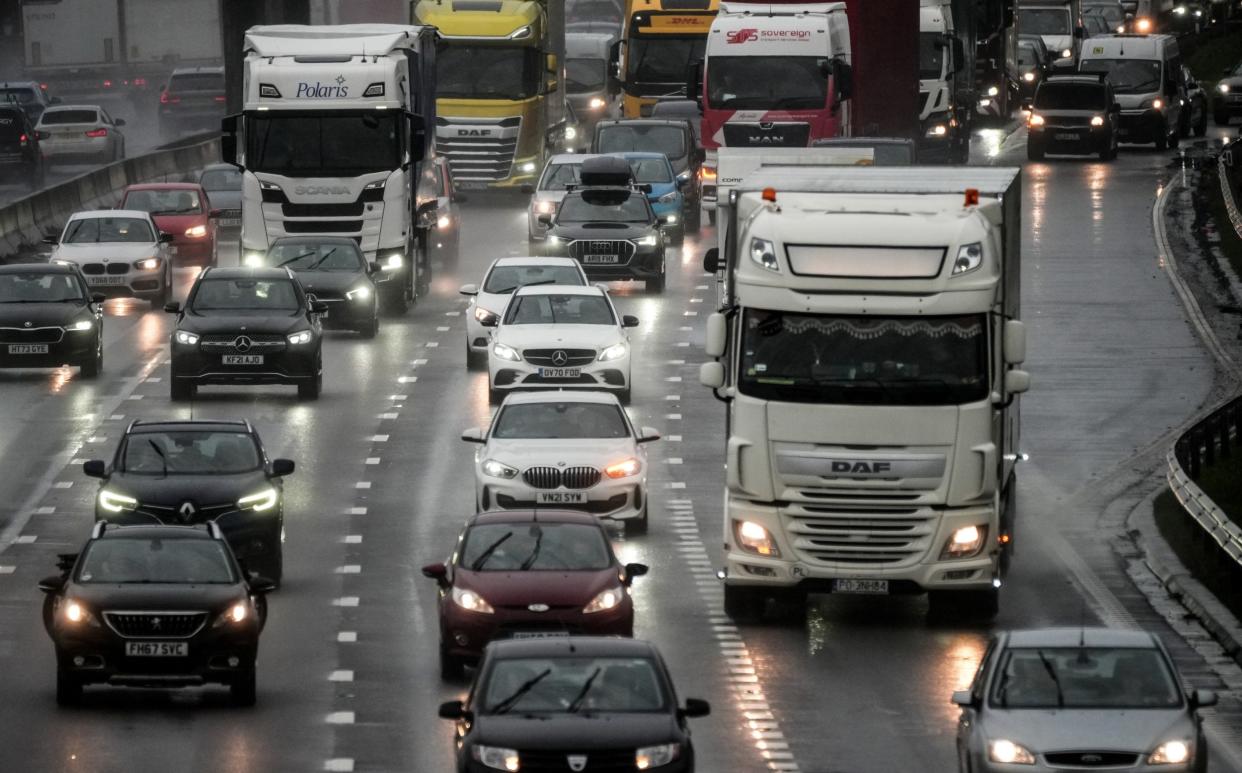 Afternoon rush hour and bank holiday traffic begins to build up on M6 motorway through Cheshire