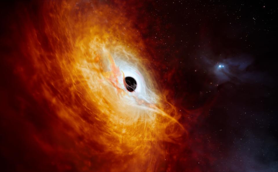 This handout artist's impression shows the supermassive black hole that astronomers identified as being able to absorb the equivalent of one sun per day, at the heart of the brightest quasar observed. The research was published in a study in scientific journal Nature.