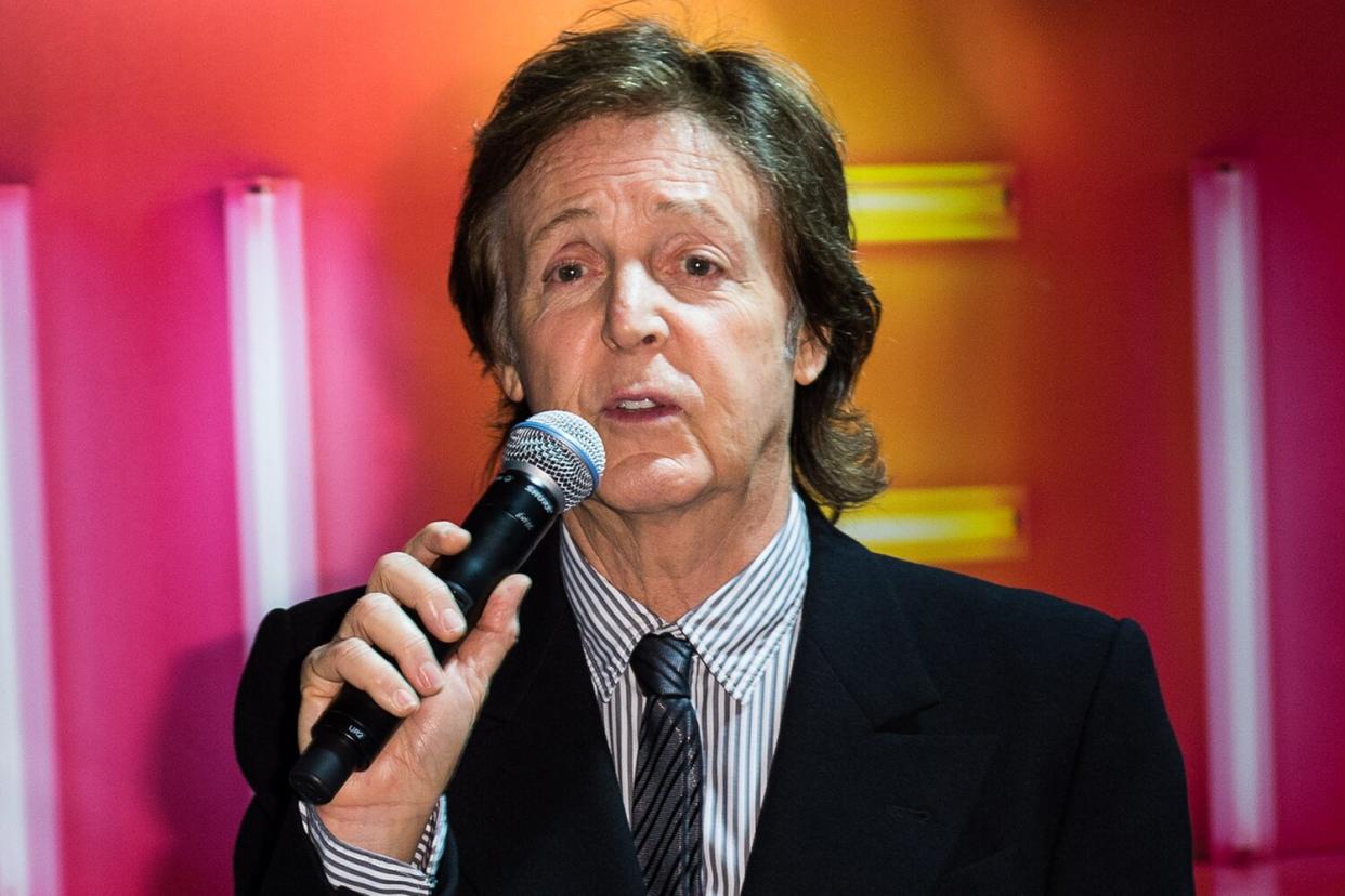 Paul McCartney meets fans and signs copies of his album 'New' at HMV, Oxford Street on October 18, 2013 in London, England.