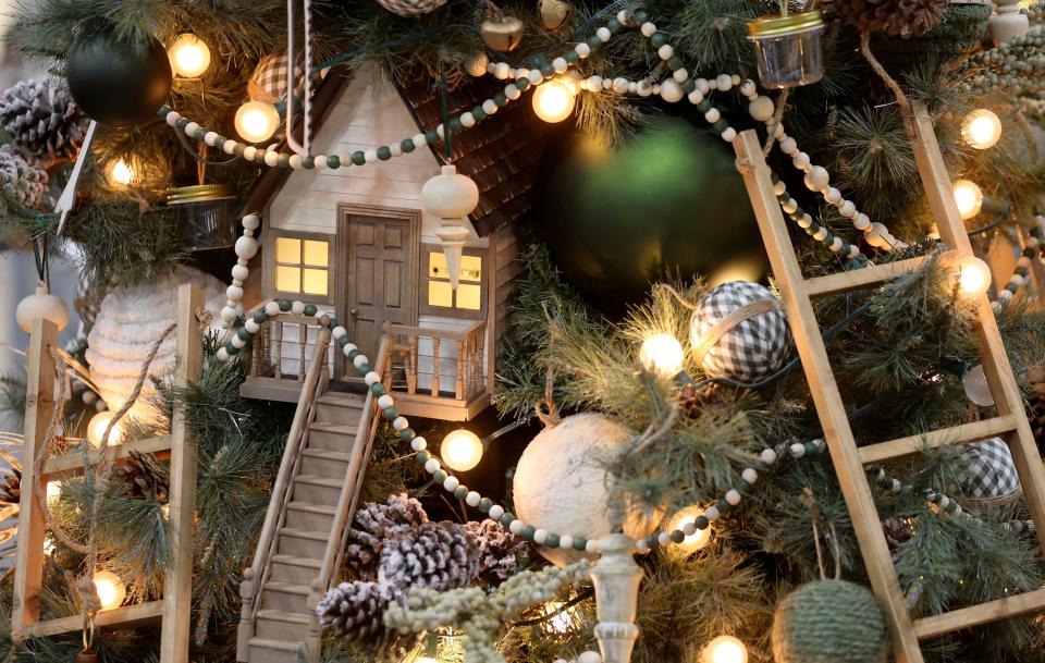 The Bob and the Treehouse tree, decorated by Ali Fenlon in honor of her father Bob, is pictured at the 53rd annual Festival of Trees to benefit Intermountain Primary Children’s Hospital patients, at the Mountain America Expo Center in Sandy on Monday, Nov. 27, 2023.