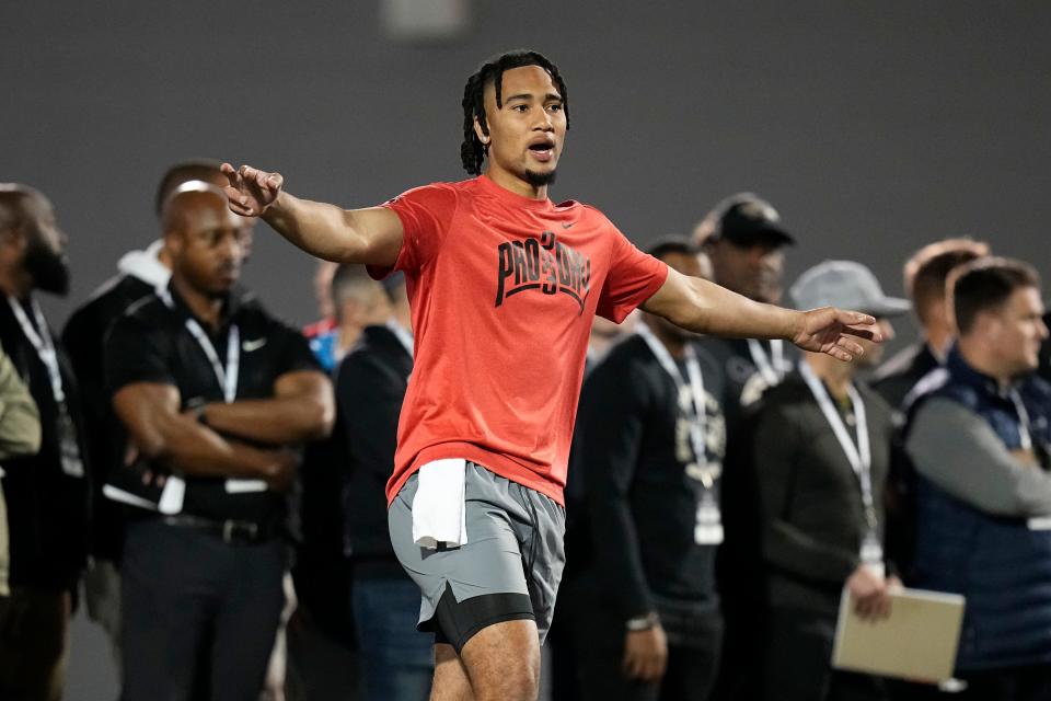 Ohio State Buckeyes quarterback C.J. Stroud lines up his wide receivers while throwing during Ohio State football’s pro day at the Woody Hayes Athletic Center in Columbus on March 22, 2023. 