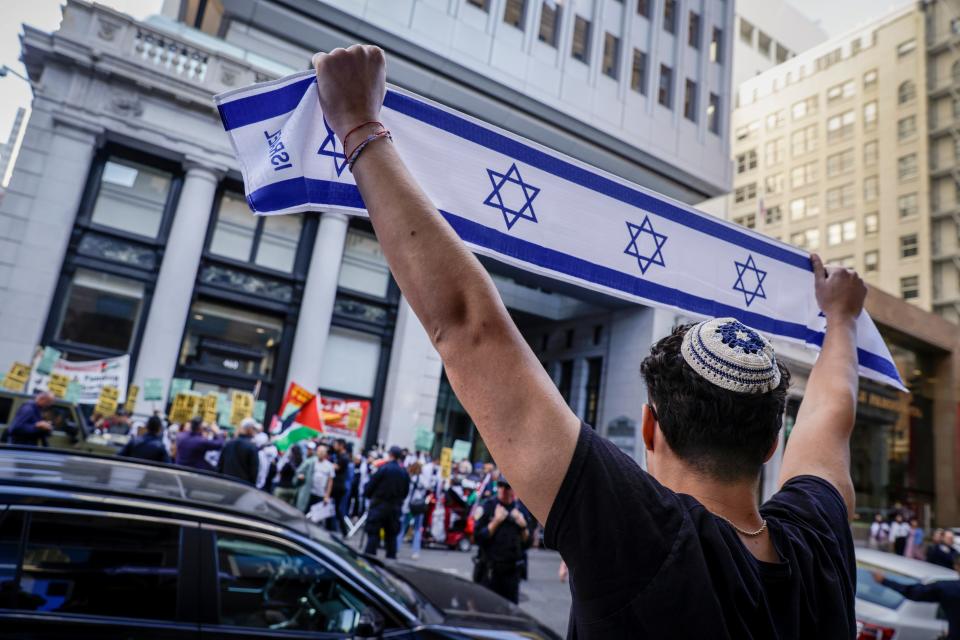 Hundreds Palestinian and Israeli supporters gather outside of the Consulate of Israel in San Francisco on Sunday, Oct. 8, 2023. Across the U.S., groups are holding opposing rallies as Israel officially declares war following a surprise attack by Hamas on Saturday. More than 1,000 people have died since the attack and Israel's retaliation.