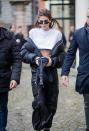 <p>During a day out in Milan, the model wore a black puffer jacket off her shoulders with a white T-shirt. </p>