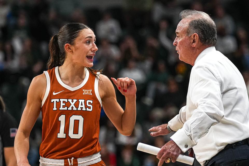 Texas guard Shay Holle talks to head coach Vic Shaefer during a Feb. 1 game against Baylor. The Longhorns won 33 games this season and finished No. 7 in the Associated Press' final Top 25 poll and are generating early buzz as a top-five team for next season.
