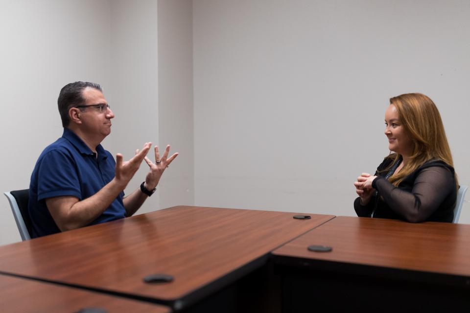Senior Planner for the city of El Paso Andrew Salloum and Tamara Gastelum, the owner of El Paso SLI Sign Language Interpreters, sign to each other on April 14. Gastelum is planning a picnic gathering for deaf people.