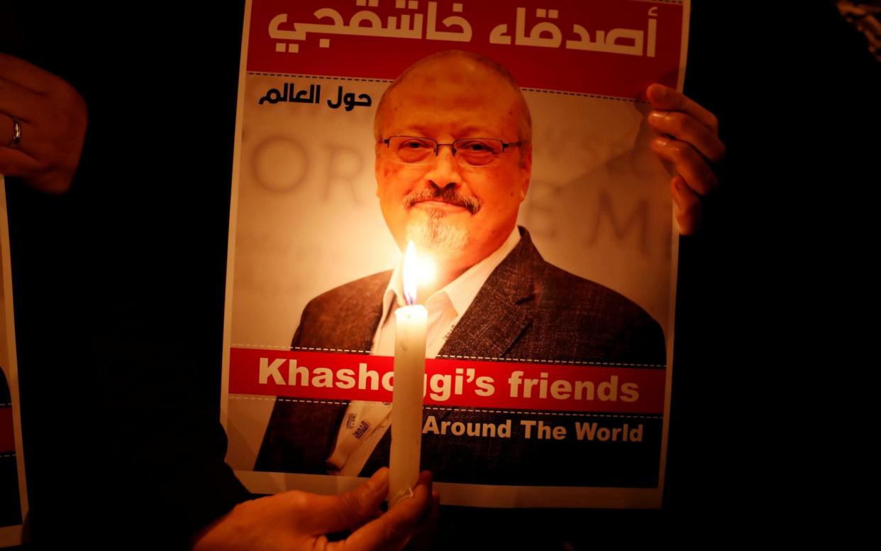  A demonstrator holds a poster with a picture of Saudi journalist Jamal Khashoggi outside the Saudi Arabia consulate in Istanbul - Reuters