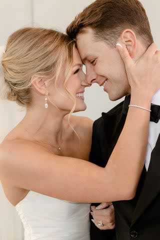 <p><a href="https://www.instagram.com/ivoryandbliss/" data-component="link" data-source="inlineLink" data-type="externalLink" data-ordinal="1">@ivoryandbliss</a></p> Brock Purdy and Jenna Purdy smiling on their wedding day.