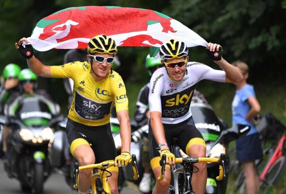 Geraint Thomas and Luke Rowe holding Wales flag