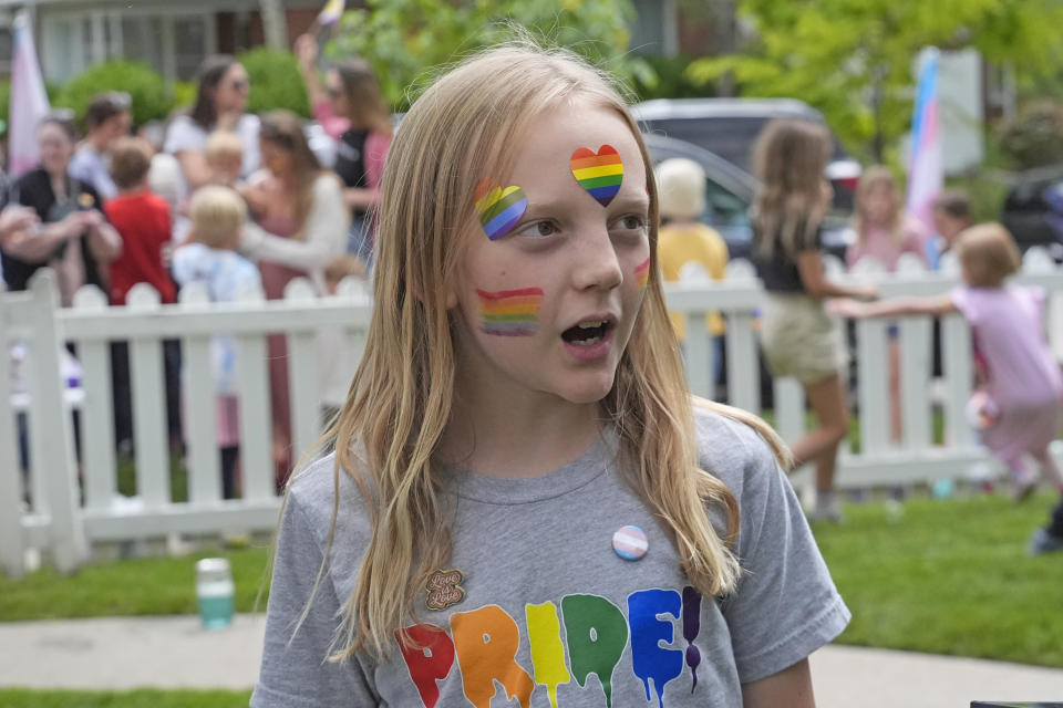 Bonneville Elementary School 5th grader Graham Beeton, is interviewed during a block party supporting trans and non binary students and staff Monday, April 29, 2024, in Salt Lake City. Utah will become the latest state to implement restrictions for transgender people using school bathrooms and locker rooms in public schools and government-owned buildings when key components of a law passed by the Republican controlled Legislature take effect May 1. (AP Photo/Rick Bowmer)