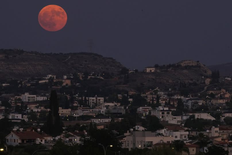 The super moon rises over the Pera Chorio Nisou outskirt of capital Nicosia, Cyprus, on Monday, Aug. 19, 2024.