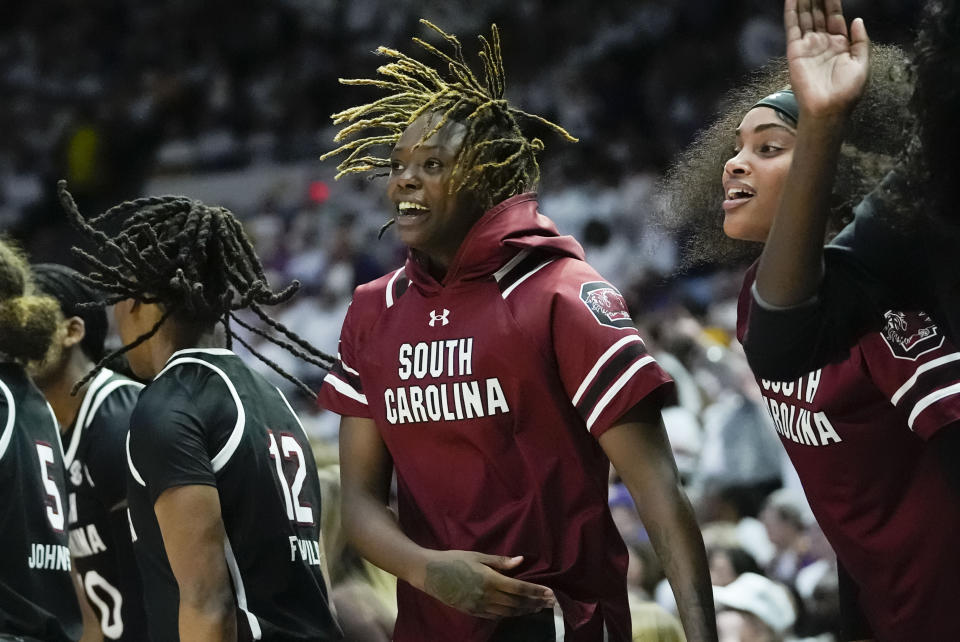 South Carolina forward Sahnya Jah celebrates on the bench in the second half an NCAA college basketball game against LSU in Baton Rouge, La., Thursday, Jan. 25, 2024. South Carolina won 76-70. (AP Photo/Gerald Herbert)