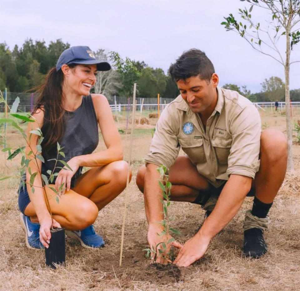 Madeleine West planting trees with her boyfriend, Byron Bay environmentalist Maximo Bottaro. Photo: Instagram/madmadswest.