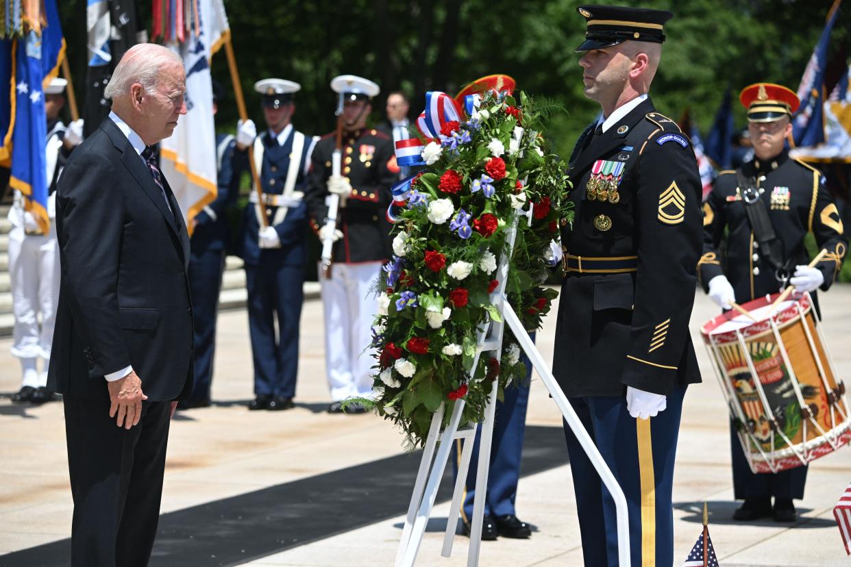President Joe Biden participates in a wreath-laying ceremony at the Tomb of the Unknown Soldier in honor of Memorial Day at Arlington National Cemetery in Arlington, Virginia on May 30, 2022.