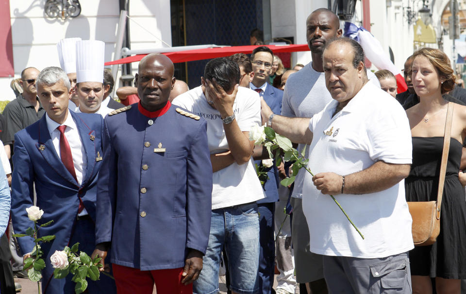 Hotel employees observe a minute of silence in Nice