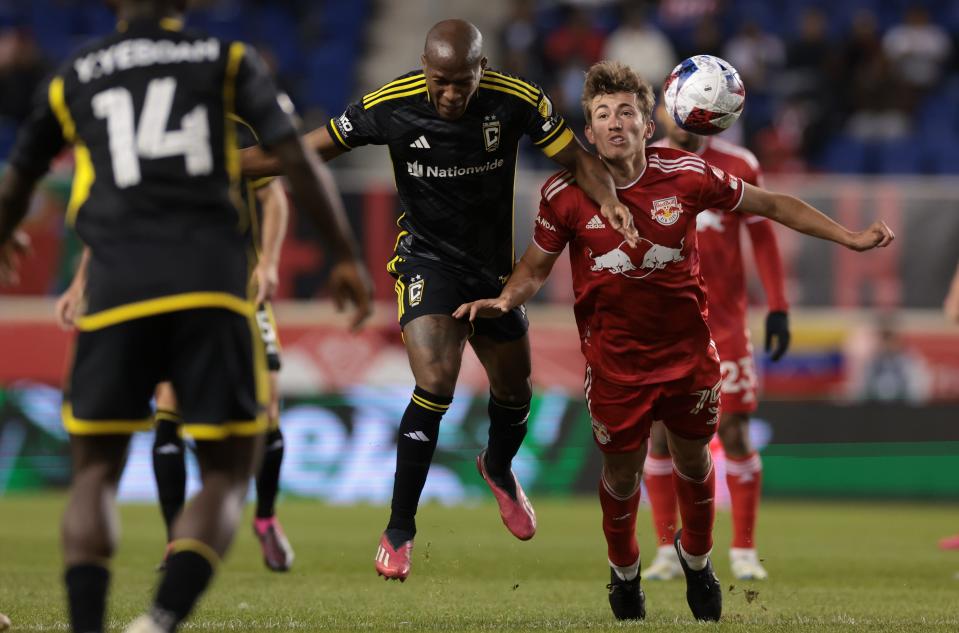 Mar 18, 2023; Harrison, New Jersey, USA; New York Red Bulls midfielder Daniel Edelman (75) fights for the the ball against Columbus Crew midfielder Darlington Nagbe (6) at Red Bull Arena. Mandatory Credit: Vincent Carchietta-USA TODAY Sports