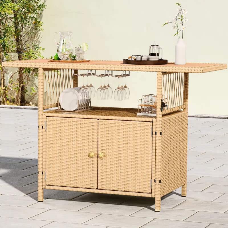 Wicker outdoor bar cart with a glassware rack, storage, and countertop