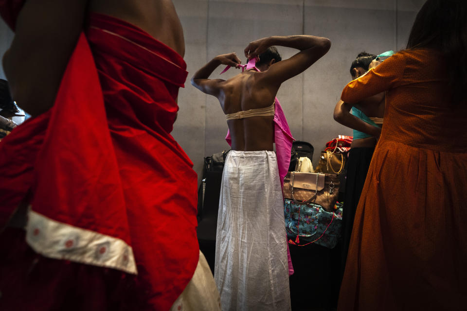 Contestants get ready for the Miss Trans Northeast 22, beauty pageant in Guwahati, India, Wednesday, Nov. 30, 2022. In a celebration of gender diversity and creative expression, a beauty pageant in eastern Indian state of Assam brought dozens of transgender models on stage in Guwahati. Sexual minorities across India have gained a degree of acceptance especially in big cities and transgender people were given equal rights as a third gender in 2014. But prejudice against them persists and the community continues to face discrimination and rejection by their families. (AP Photo/Anupam Nath)