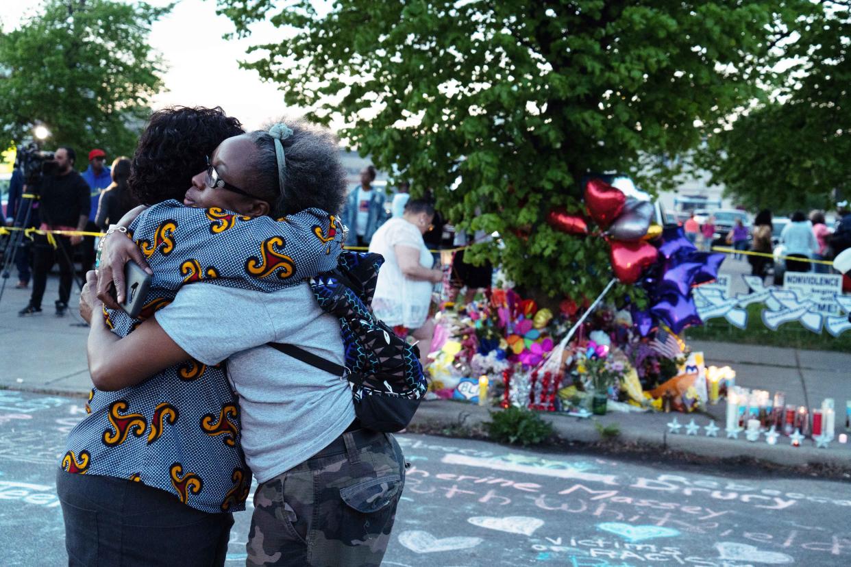 Two women embrace each other during the community vigil for the victims of the shooting in Buffalo, N.Y., on Sunday. (Joshua Thermidor for NBC News)