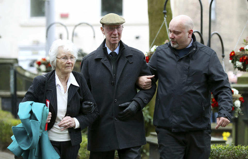 Former football player and manager Jack Charlton, centre and his wife Pat arrive at the funeral service for Gordon Banks at Stoke Minster, in Stoke on Trent, England, Monday March 4, 2019. Banks died on Feb. 12 aged 81. (Nick Potts/PA via AP)